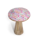 Wooden mushroom ornament featuring a pink and purple floral pattern on the cap